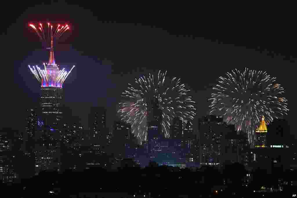 Fireworks explode from the Empire State Building and over the New York City skyline during Macy&#39;s 4th of July fireworks display, July 4, 2021, as seen from Jersey City, New Jersey.