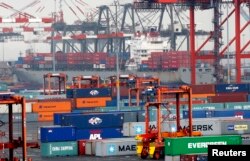 FILE - Shipping containers are seen at the Port Newark Container Terminal near New York City.