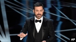 FILE - Host Jimmy Kimmel speaks at the Oscars at the Dolby Theatre in Los Angeles, Feb. 26, 2017. 