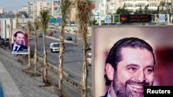 Posters depicting Saad al-Hariri, who announced his resignation as Lebanon's prime minister from Saudi Arabia, is seen at airport high way in Beirut, Lebanon, Nov. 19, 2017. 