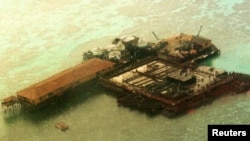 FILE - An aerial view of one of the structures built by China at the Philippine-claimed Mischief Reef, Spratly Islands in South China Sea.
