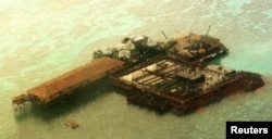 FILE - An aerial view of one of the structures built by China at the Philippine-claimed Mischief Reef, Spratly Islands in South China Sea.