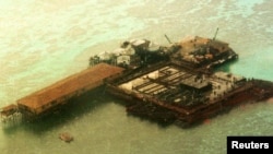 FILE - An aerial view of one of the structures built by China at the Philippine-claimed Mischief Reef, Spratly Islands in South China Sea.