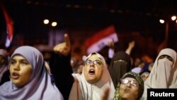 Supporters of the deposed Egyptian President Mohamed Mursi shout anti-army slogans during a sit-in protest in Cairo Jul 11, 2013.