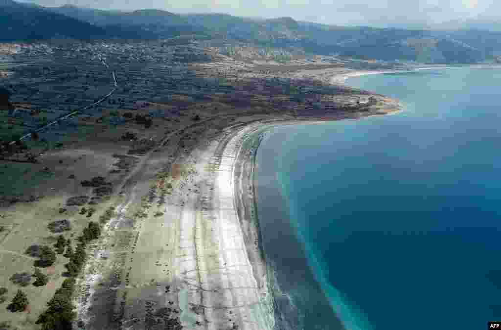 This aerial picture shows the shore of the southwestern Turkey Salda lake, in Burdur province. NASA believes the lake could offer clues to a crater on Mars but environmental activists fear the natural phenomenon with its bright white sand and sparkling turquoise waters is at risk.&nbsp;