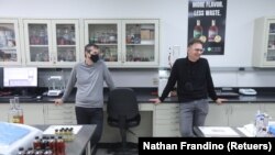Bespoken Spirits co-founders Stu Aaron and Martin Janousek stand in the company's lab in Menlo Park, California, U.S. on October 20, 2021. (REUTERS/Nathan Frandino)