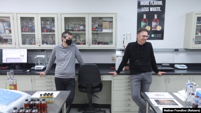 Bespoken Spirits co-founders Stu Aaron and Martin Janousek stand in the company's lab in Menlo Park, California, U.S. on October 20, 2021. (REUTERS/Nathan Frandino)
