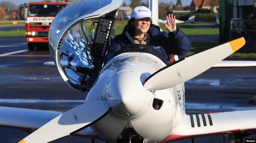 Belgian-British pilot Zara Rutherford, 19, gestures following her landing at Kortrijk-Wevelgem Airport, after a round-the-world trip in a light aircraft, in Wevelgem, Belgium, January 20, 2022. (REUTERS/Pascal Rossignol)