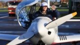 Belgian-British pilot Zara Rutherford, 19, gestures following her landing at Kortrijk-Wevelgem Airport, after a round-the-world trip in a light aircraft, in Wevelgem, Belgium, January 20, 2022. (REUTERS/Pascal Rossignol)