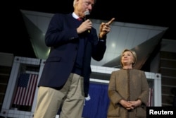 Former U.S. President Bill Clinton campaigns for his wife, Democratic presidential candidate Hillary Clinton, as she rallies with supporters at an outdoor plaza in Columbia, South Carolina, Feb. 26, 2016.