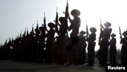 FILE - New recruits of Rajputana and Assam Rifles, units of the Indian army, swear their oaths of allegiance during a parade in New Delhi, June 1, 2002. 