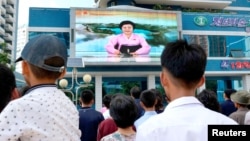 FILE - North Koreans watch a news report showing North Korea's nuclear test in Pyongyang, North Korea, Sept. 3, 2017. (Kyodo/via Reuters)