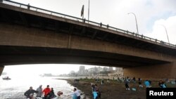 FILE: Egyptian youth volunteers collect waste and plastic as part of a campaign to clean up the Nile River sponsored by Egypt's environment ministry in cooperation with VeryNile and Greenish, in Cairo, Egypt, Feb. 10, 2019. 