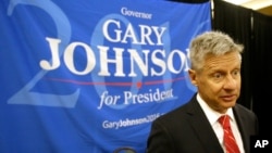 FILE - Libertarian presidential candidate Gary Johnson speaks to supporters and delegates at the National Libertarian Party Convention, in Orlando, Fla.