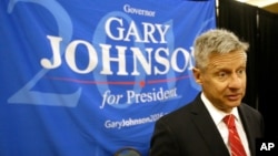 FILE - Libertarian presidential candidate Gary Johnson speaks to supporters at the National Libertarian Party Convention, in Orlando, Florida, May 27, 2016. He and Green Party candidate Jill Stein did not qualify to participate in the Sept. 26 presidential debate.