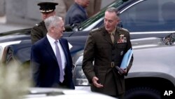 Defense Secretary Jim Mattis, left, and Joint Chiefs Chairman Gen. Joseph Dunford talk as they walk away from a briefing of U.S. lawmakers on the situation on the Korean Peninsula, at the Eisenhower Executive Office Building at the White House complex in Washington, April 26, 2017.