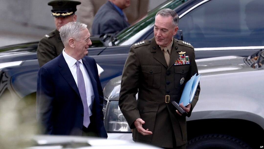 Defense Secretary Jim Mattis and Joint Chiefs Chairman Gen. Joseph Dunford talks as they walk from an all Senators briefing on the situation in the Koreas, April 26, 2017, at the Eisenhower Executive Office Building on the White House complex in Washington.