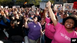 Protesters call for Mississippi Gov. Phil Bryant to veto House Bill 1523, which they say will allow discrimination against LGBT people, during a rally in Jackson, Mississippi, April 4, 2016.