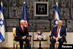 U.S. Vice President Mike Pence sits next to Israeli President Reuven Rivlin during a meeting at the President’s residence in Jerusalem, Jan. 23, 2018.