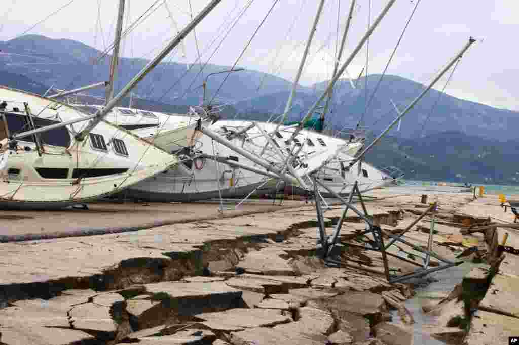 Yachts are seen knocked off their stands at a damaged dock after an earthquake in Lixouri on the island of Kefalonia, western Greece, Feb. 3, 2014. A strong earthquake with a preliminary magnitude between 5.7 and 6.1 hit the western island of Kefalonia, sending scared residents into the streets.