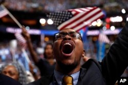 A supporter cheers as Democratic presidential nominee Hillary Clinton speaks during the final day of the Democratic National Convention in Philadelphia, July 28, 2016.