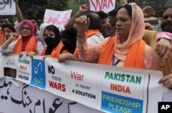 Members of the Pakistani Civil Society Forum take part in a demonstration for peace and condemning the raising tensions between Pakistan and India, in Lahore, Pakistan, Sept. 28, 2016.