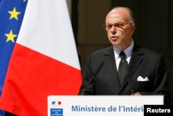FILE - French Interior Minister Bernard Cazeneuve attends a news conference at the Interior ministry in Paris, France. Cazeneuve said the new controls will remain in place for a few weeks before and after the conference.