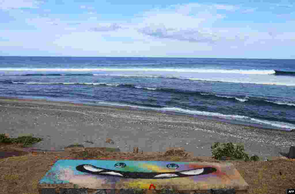 A view of la tortue (the turtle) surfing spot in Saint-Leu, on the French Indian Ocean island of La Reunion, where a surfer was killed by a shark the day before, the latest fatality in increasingly dangerous waters.