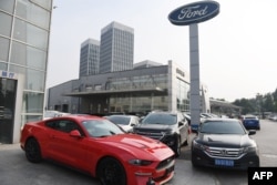 A Ford Mustang is seen at a dealership in Beijing on July 6, 2018.