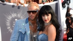 Riff Raff and Katy Perry arrive at the MTV Video Music Awards at The Forum on Sunday, Aug. 24, 2014, in Inglewood, Calif. (Photo by Jordan Strauss/Invision/AP)