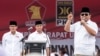 FILE - Gerindra party chairman Prabowo Subianto (R) talks to supporters.