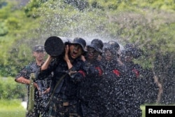   The Chinese People's Liberation Army takes to the Hong Kong military base last month 