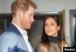 FILE - Prince Harry and fiancee Meghan Markle in London.