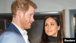 FILE - Prince Harry and fiancee Meghan Markle in London. 