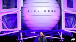 Jeff Bezos speaks in front of a model of Blue Origin's Blue Moon lunar lander, May 9, 2019, in Washington.