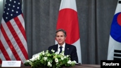 FILE - U.S. Secretary of State Antony Blinken takes part in a trilateral meeting with Japan and South Korea on the sidelines of the G-7 foreign ministers meeting in London, Britain, May 5, 2021.