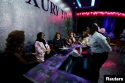 Women sit at Luxury Time, the city's first women-only restaurant, in Irbil, Iraq, July 17, 2018.