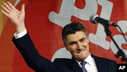 Croatian opposition party leader Zoran Milanovic celebrates the parliamentary election after exit polls showed his party won a majority in parliament, in Zagreb, Croatia, December 4, 2011.