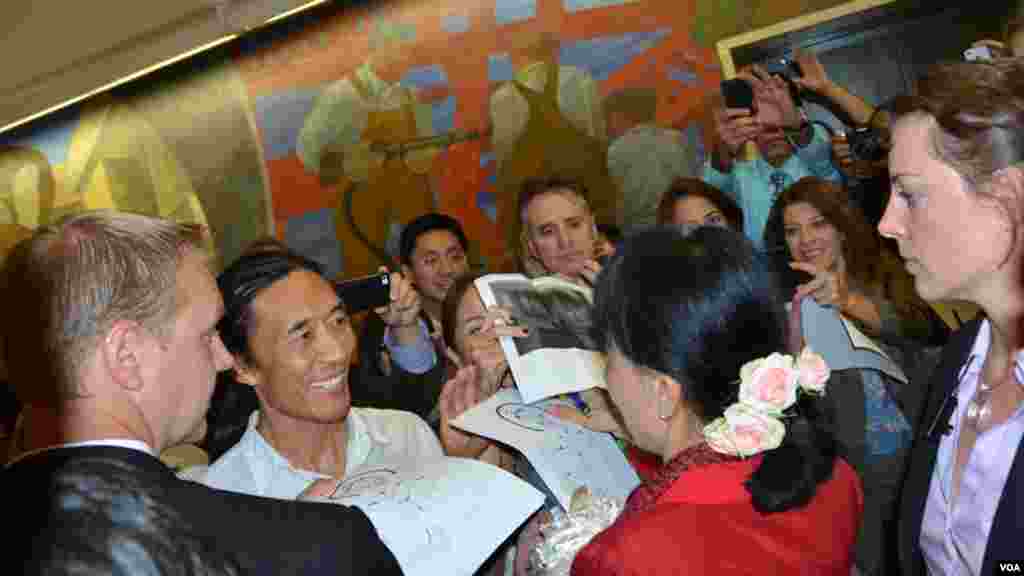 Aung San Suu Kyi granted VOA several interviews over the years, and her fans at the headquarters gather around to get an autograph and picture.