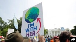 Thousands March Against Trump Administration Policies on Climate Change