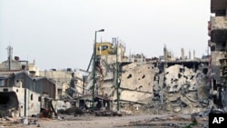 Cảnh nhà cửa trong quận Inshaat của thành phố Homs bị tàn phá