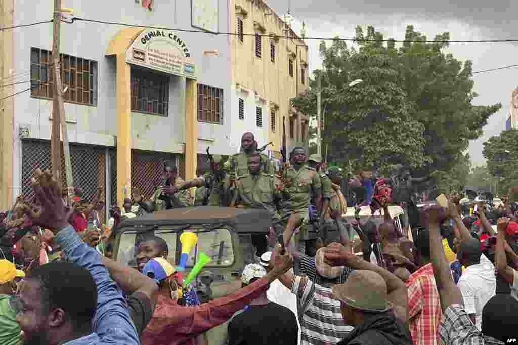 Malian soldiers arrive at the Independence Square in Bamako. Prime Minister Boubou Cisse called for "fraternal dialogue" with soldiers who seized a key military garrison and have triggered fears of a coup attempt. 