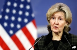 FILE - U.S. Ambassador to NATO Kay Bailey Hutchison briefs the media ahead of a NATO defense ministers meeting at the alliance headquarters in Brussels, Belgium, Feb. 13, 2018.