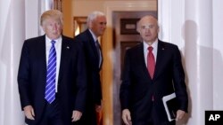  President-elect Donald Trump walks with CKE Restaurants CEO Andy Puzder from Trump National Golf Club Bedminster clubhouse in Bedminster, N.J.