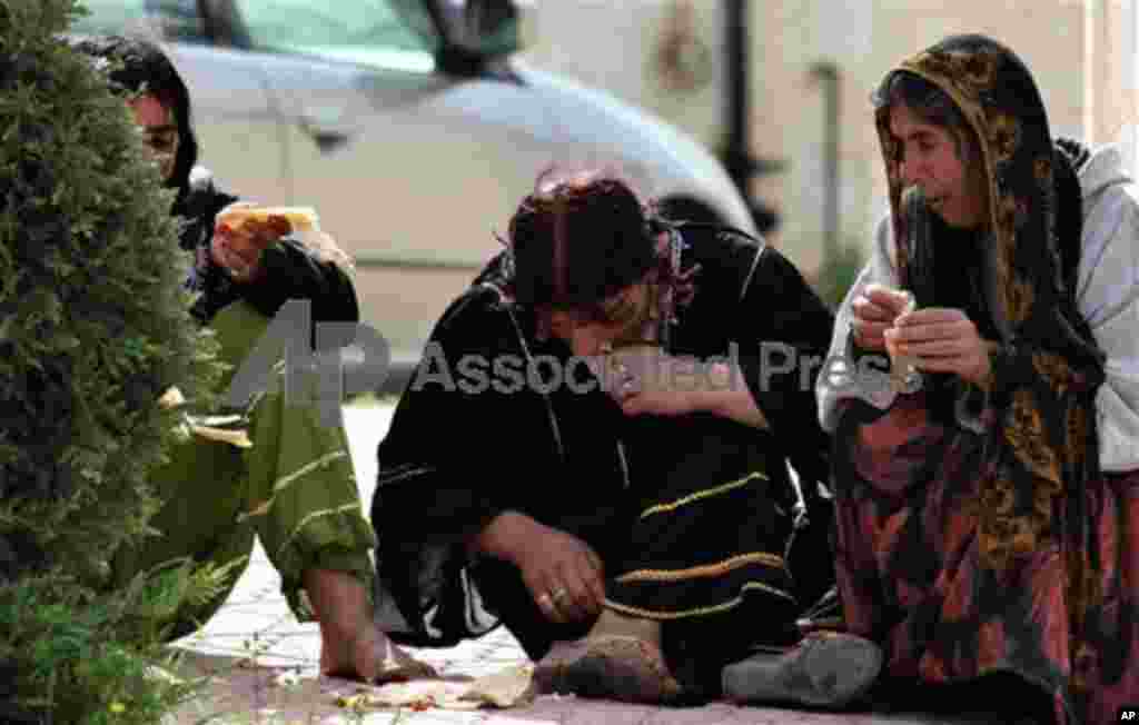 Gypsies living in Amman, Jordan are seen on Wednesday March 17, 2010 eating breakfast in western Amman. (AP Photo/Mohammad Abu Ghosh)