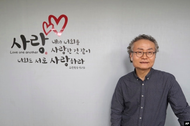 In this Nov. 1, 2019, photo, Shim Yang-sup, the principal of the Seoul-based alternative South-North Love School, speaks during an interview at his school in Seoul, South Korea.