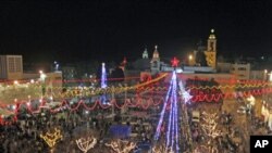 A general view shows celebrations for Christmas near the Church of the Nativity in West Bank town of Bethlehem, December 24, 2011.