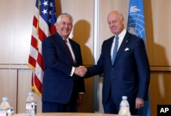 Secretary of State Rex Tillerson, left, shakes hands with U.N. Special Envoy for Syria Staffan de Mistura before their meeting on Oct. 26, 2017, in Geneva.