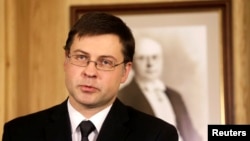 Latvia's Prime Minister Valdis Dombrovskis speaks during a news conference in Riga, Nov. 27, 2013. 