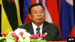 FILE - In this file picture taken on July 26, 2005, then Lao Prime Minister Bounnhang Vorachith addresses the opening ceremony of the 36th annual ministerial meeting of the Association of Southeast Asian Nations (ASEAN) in Vientiane. 